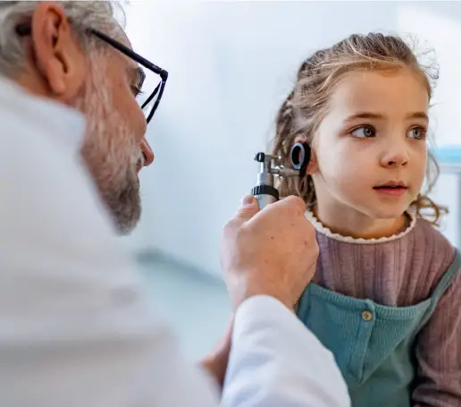 Urgent Care physician examining child patient's ear | Coastal River Weight Loss Clinic